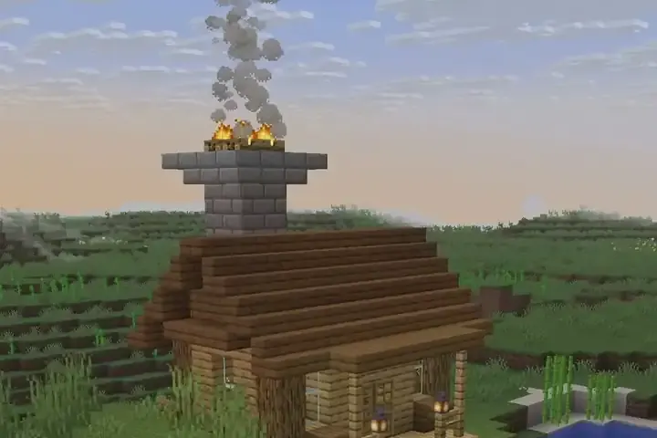 A wooden shore cabin with a stone chimney