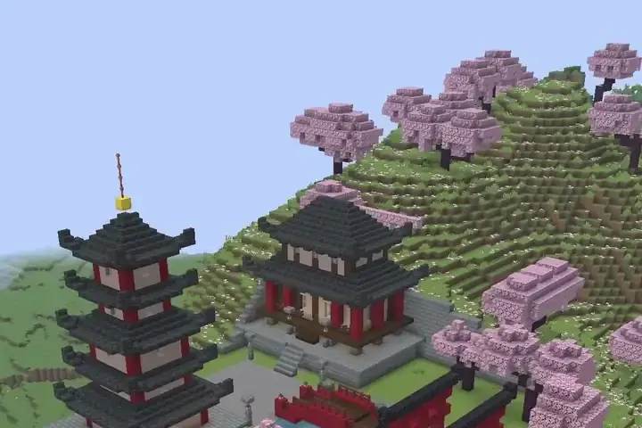 A Japanese pagoda and temple among cherry trees in a Minecraft world.